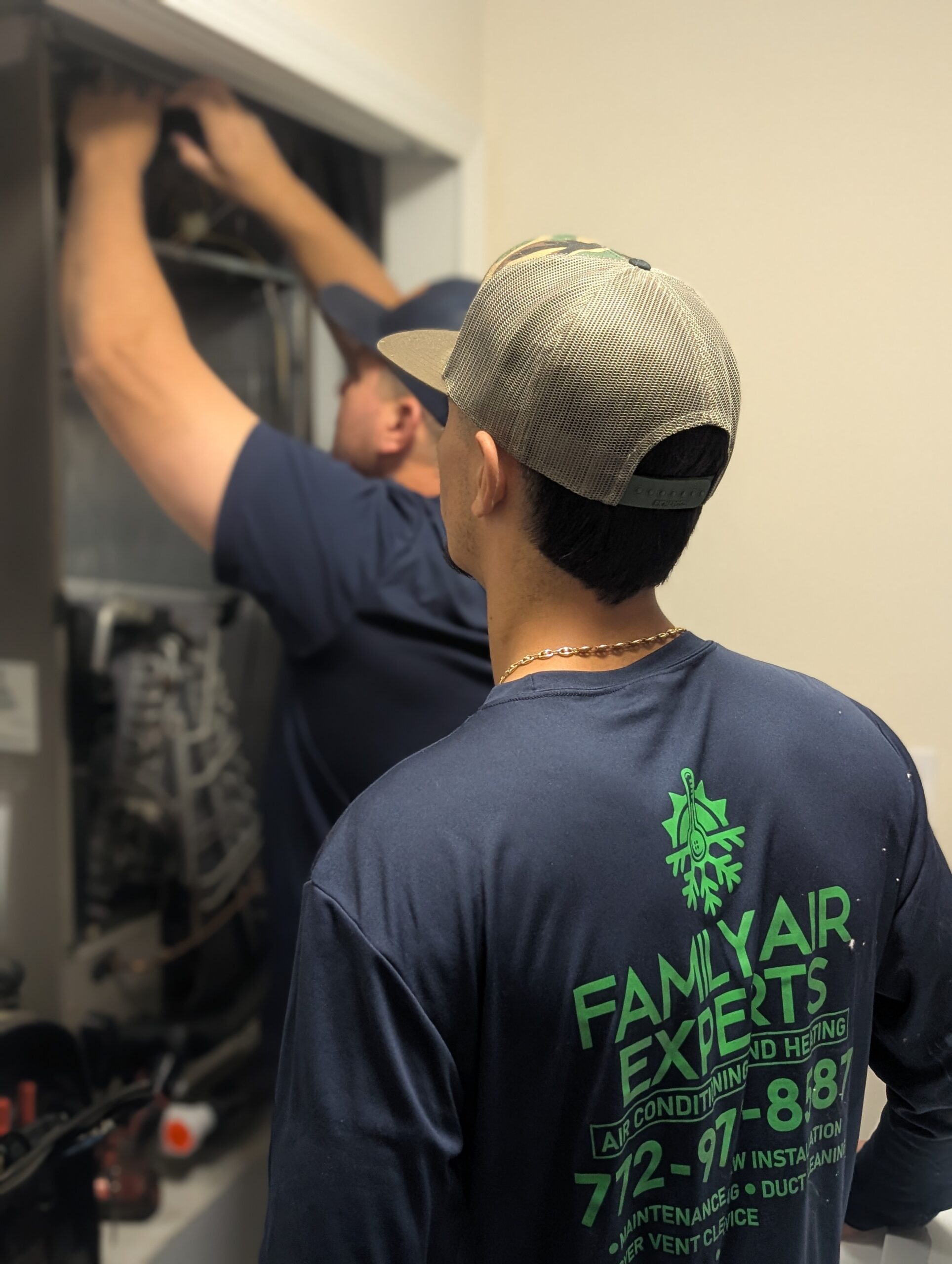 Our Owners, Dalton & Nathan, Standing with one of our Service Vans