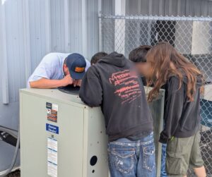 Family Air Experts introducing young adults to HVAC at TCBA Workforce Development event