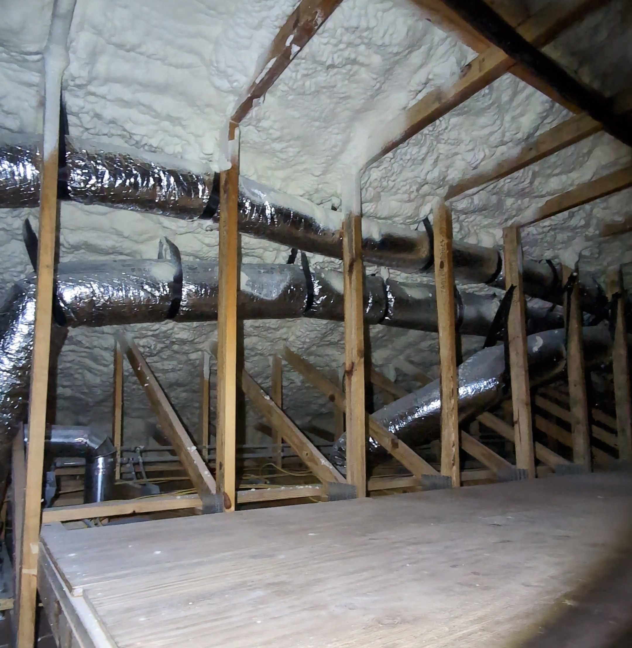 Indian River Estates Custom Home HVAC: Proven 2026 Fort Pierce Rebuild 8 Clean ductwork installation in an encapsulated attic at a custom home in Indian River Estates