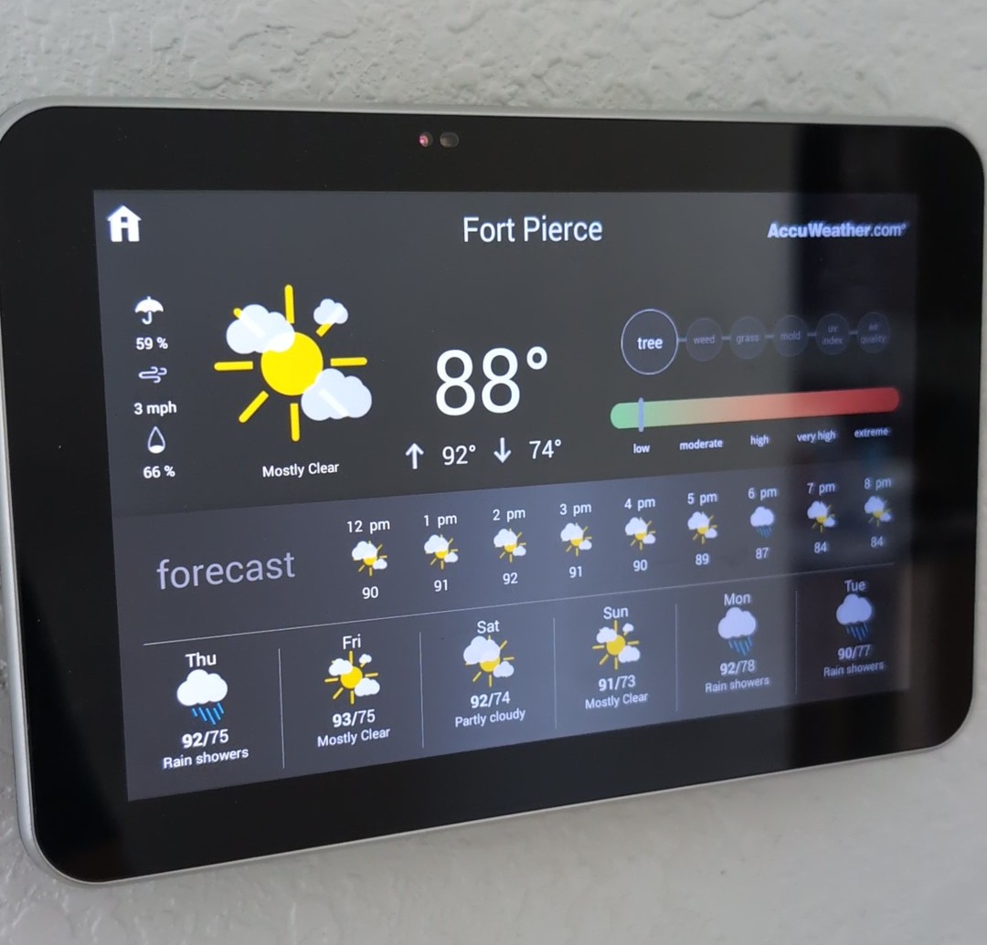Indian River Estates Custom Home HVAC: Proven 2026 Fort Pierce Rebuild 6 Lennox smart thermostat showing weather and air monitoring features in a Fort Pierce custom home