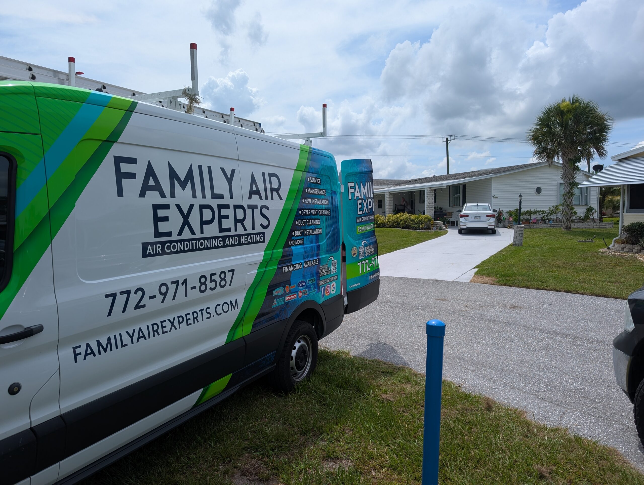 Spanish Lakes Fairways AC Replacement: Proven 2026 Fort Pierce Upgrade 2 Family Air Experts service van parked at a home in Spanish Lakes Fairways during an AC replacement in Fort Pierce